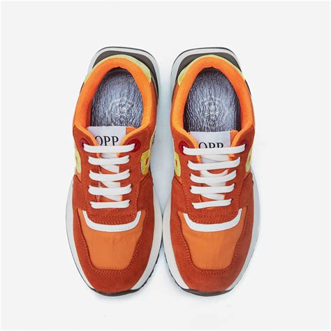 orange designer sneakers for women.